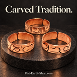 carved tradition copper ring design in a dark studio setting