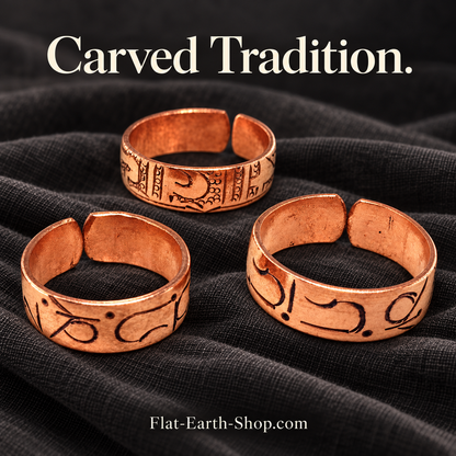 carved tradition copper ring design in a dark studio setting