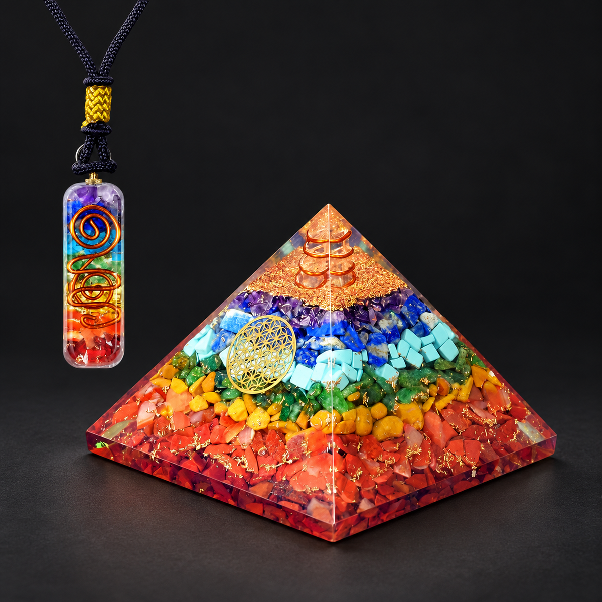Seven-Chakra Orgonite Pyramid & Pendant — Spectrum of Intention on a dark charcoal studio background