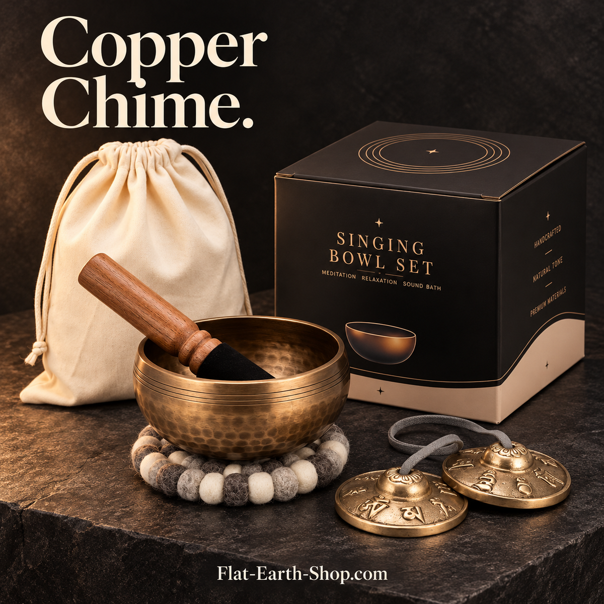 copper chime singing bowl set in dark studio