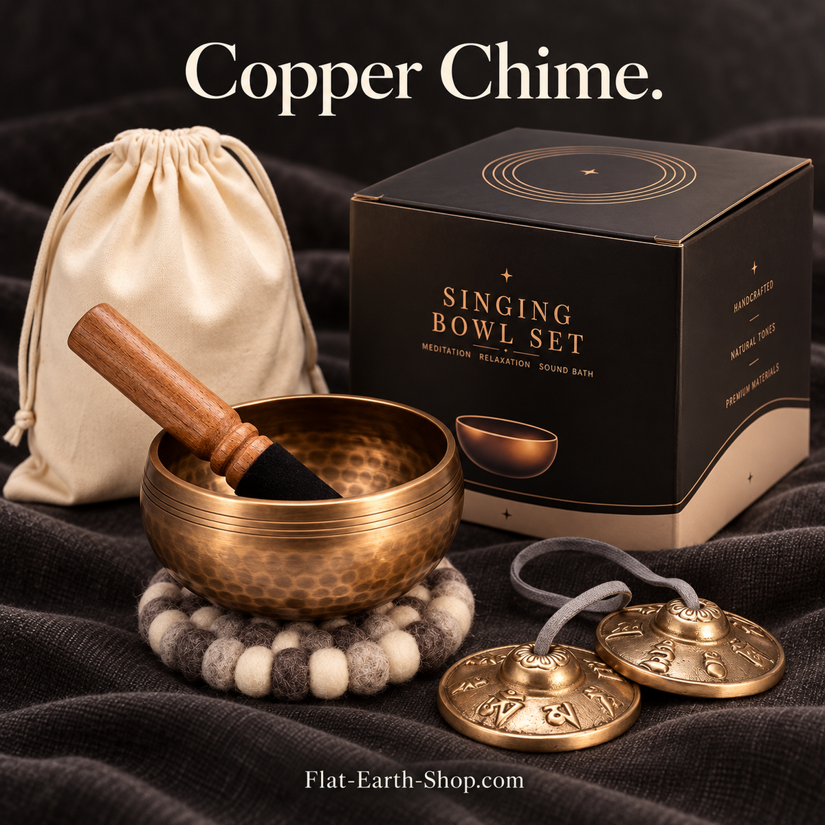 copper chime singing bowl set in dark studio