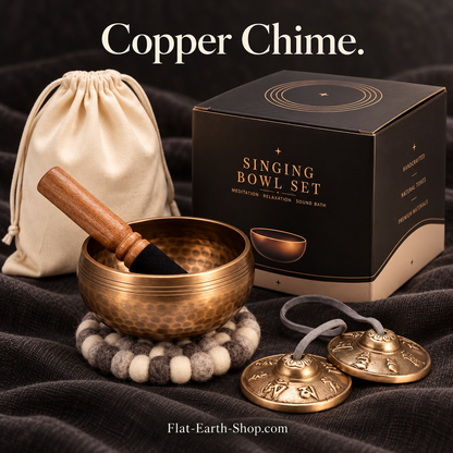 copper chime singing bowl set in dark studio