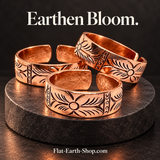 earthen bloom copper ring design in a dark studio setting