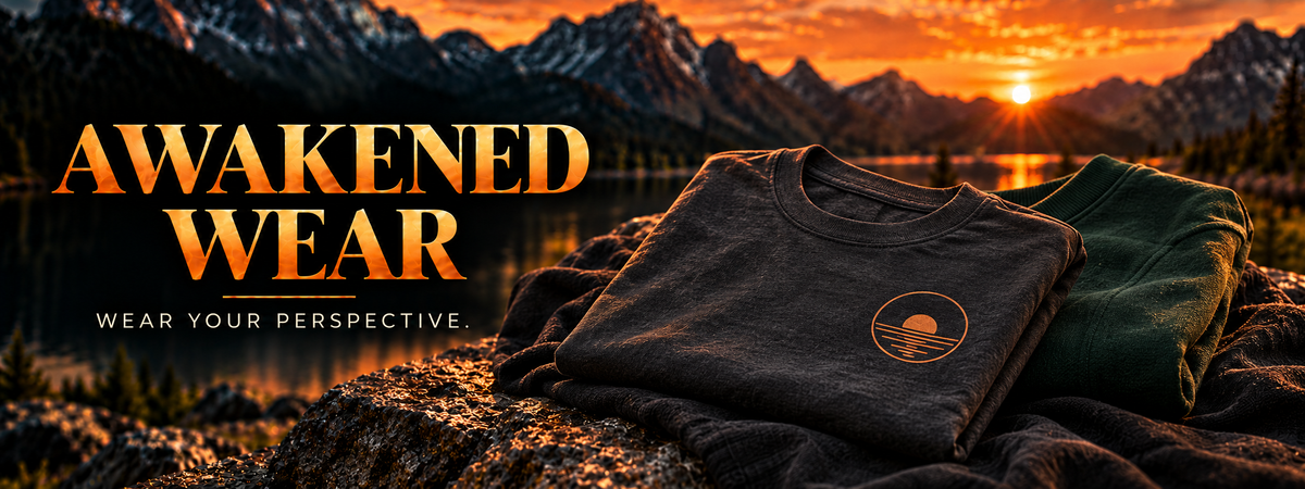Awakened Wear — Wear your perspective. Concept apparel in charcoal and forest green at sunset.