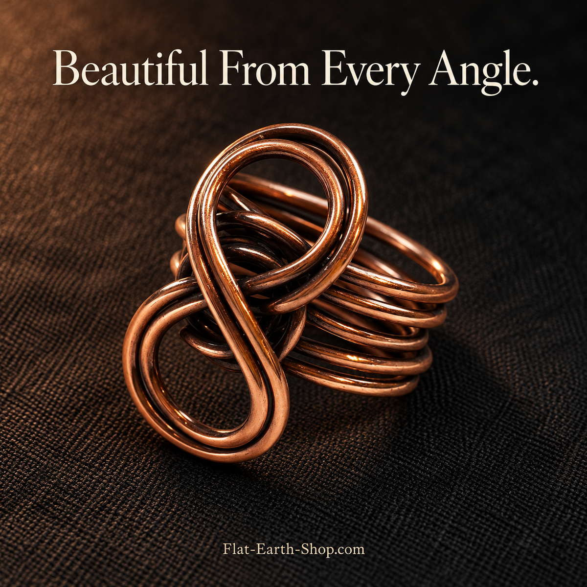 Pure Copper Eternity Ring — Handcrafted Infinity Design — second view with a dark backdrop.