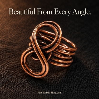 Pure Copper Eternity Ring — Handcrafted Infinity Design — second view with a dark backdrop.