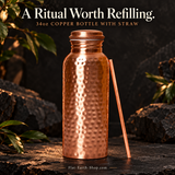 Copper Water Bottle — 34oz Wide Mouth with Straw — main product view on dark slate with warm copper lighting.
