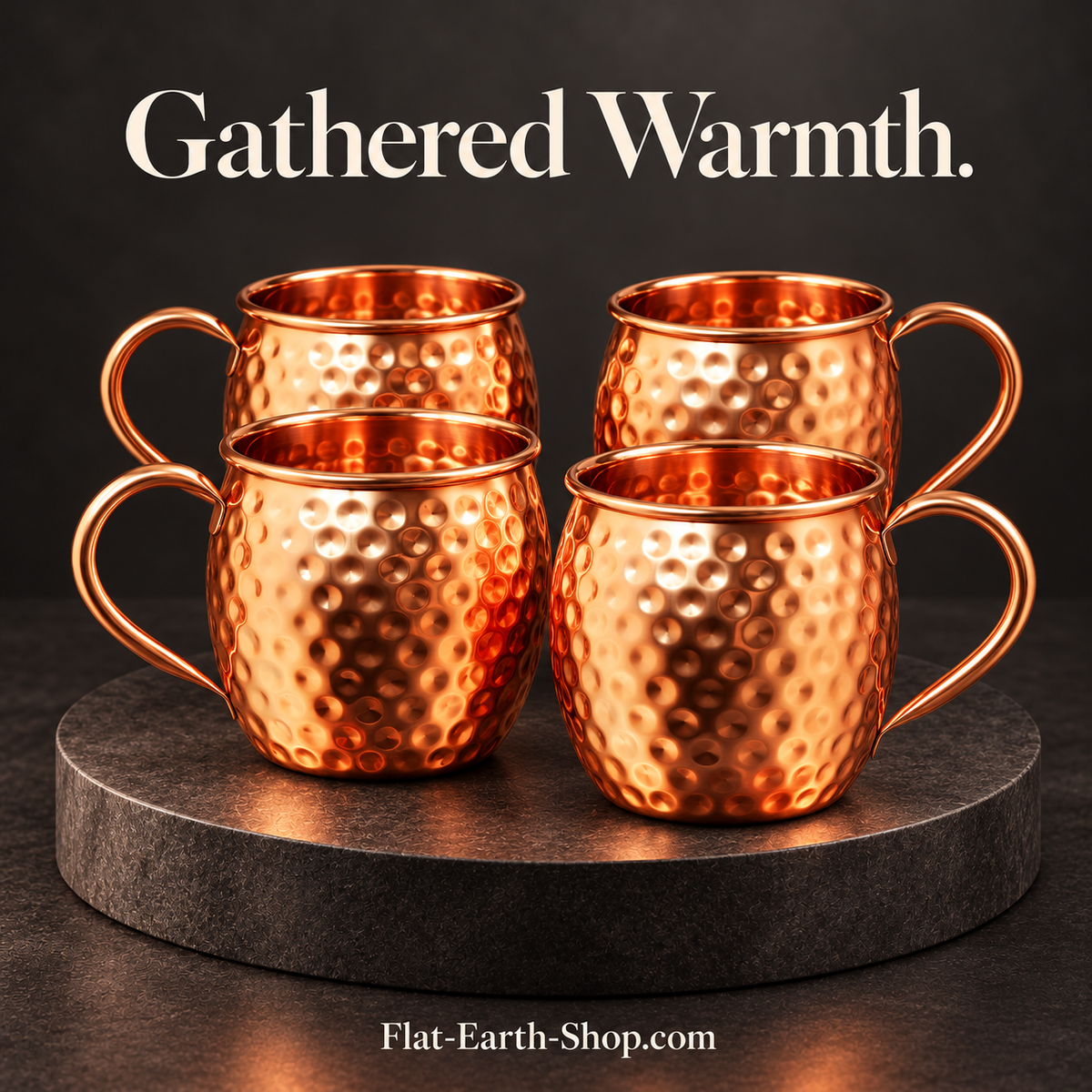 Four hammered copper mugs with curved handles in a dark studio scene