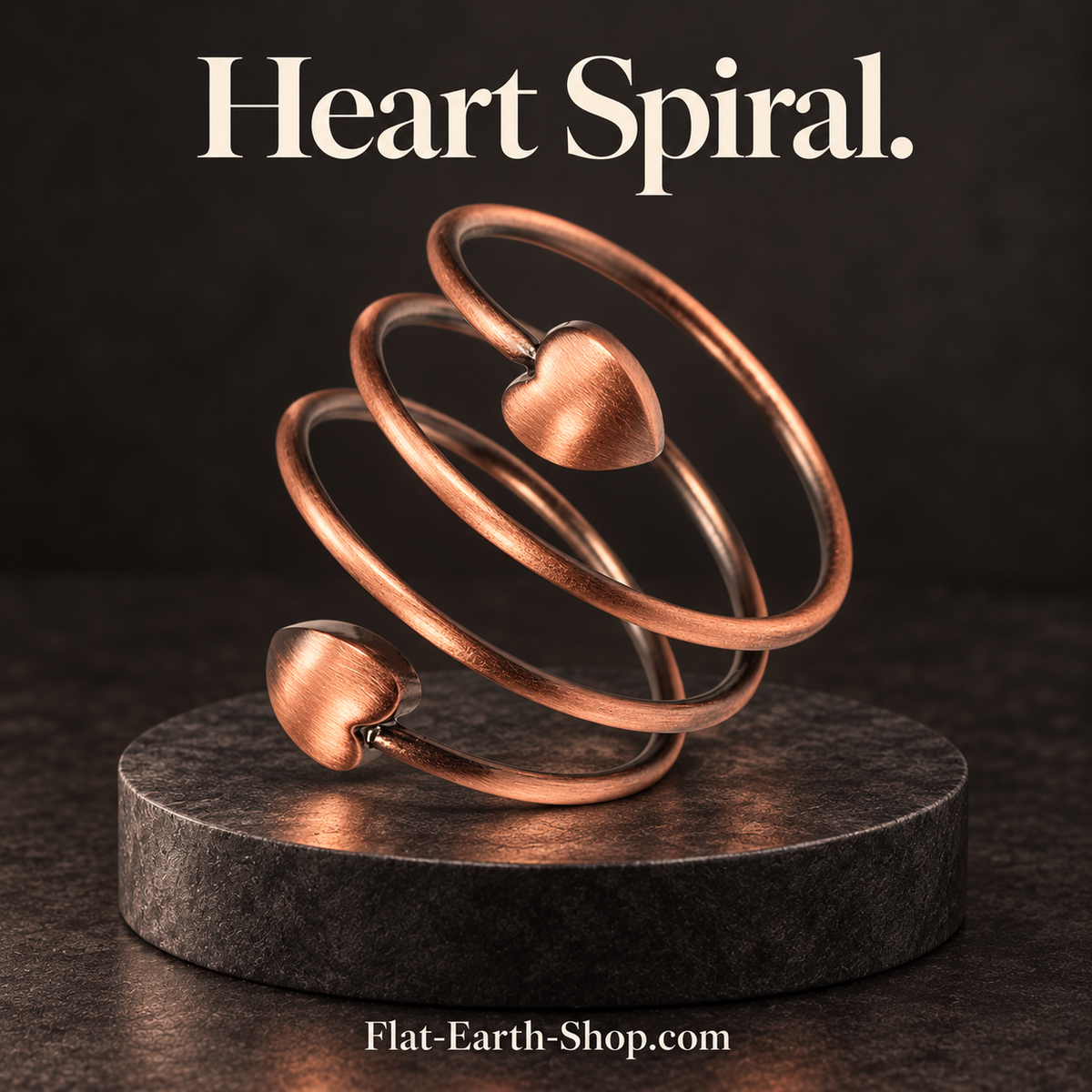 heart spiral copper ring design in a dark studio setting